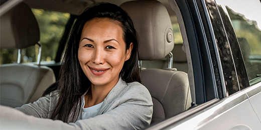 Woman driving her SUV.