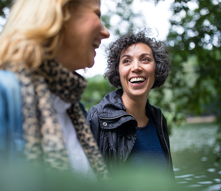 Women walking and talking together.