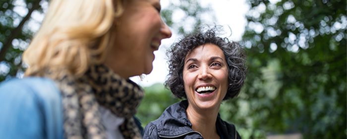 Women walking and talking together.