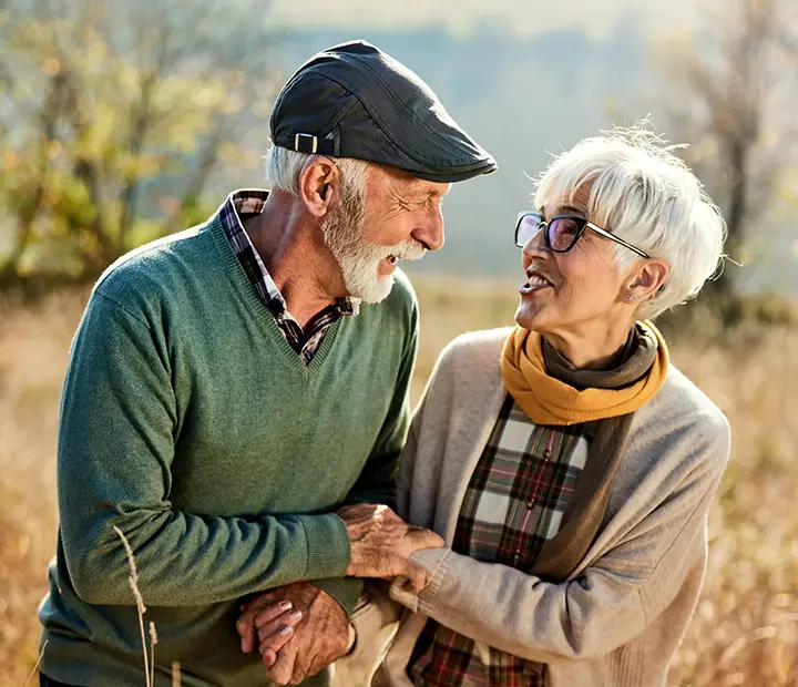 two old couple in warm embrace