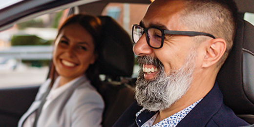 Man and woman riding in the car together.