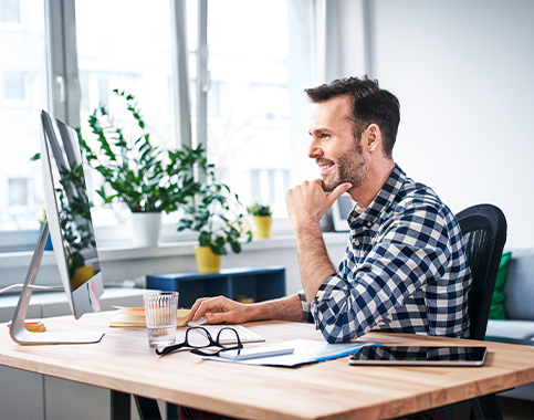 man looking at computer