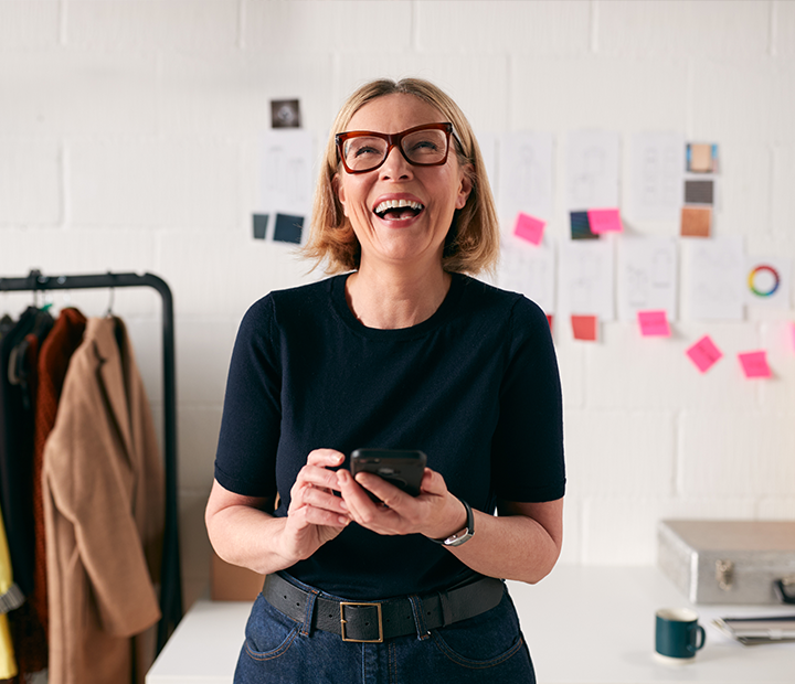 woman smiling in her office space