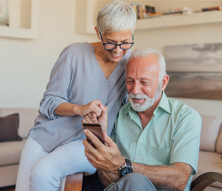 older couple looking at phone