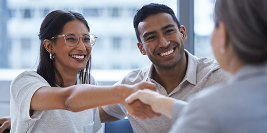couple making a deal with a financial planner