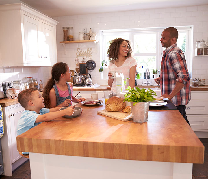 family cooking in the kitchen together
