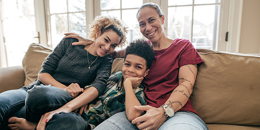 family sitting on couch
