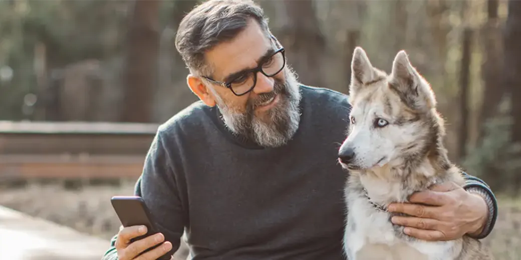 Older man with husky dog
