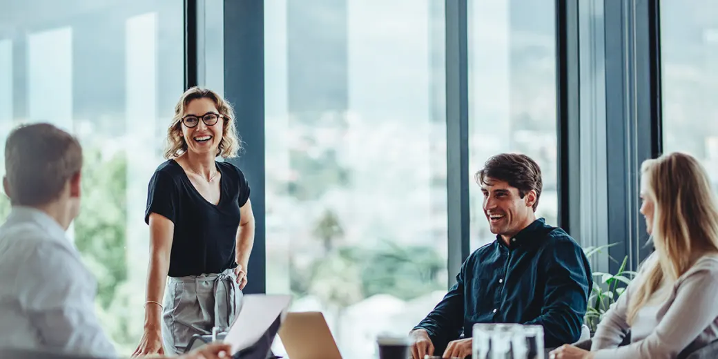 Business meeting with 4 people around a table