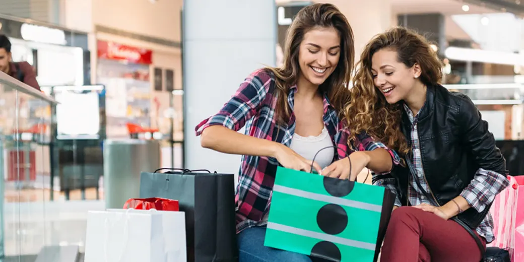 Young girls with shopping bags