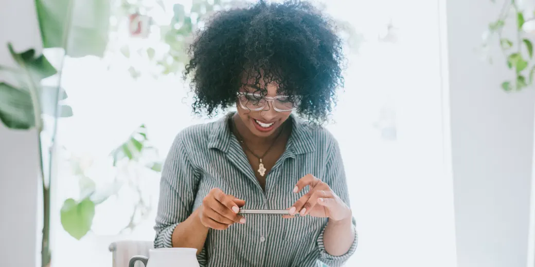 Woman taking photo of a check